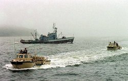 Home Comforts Laminated Poster Two U.s. Navy Light Amphibious Reconnaissance Craft Larc Ferry Past A Russian Fishing Boat As They